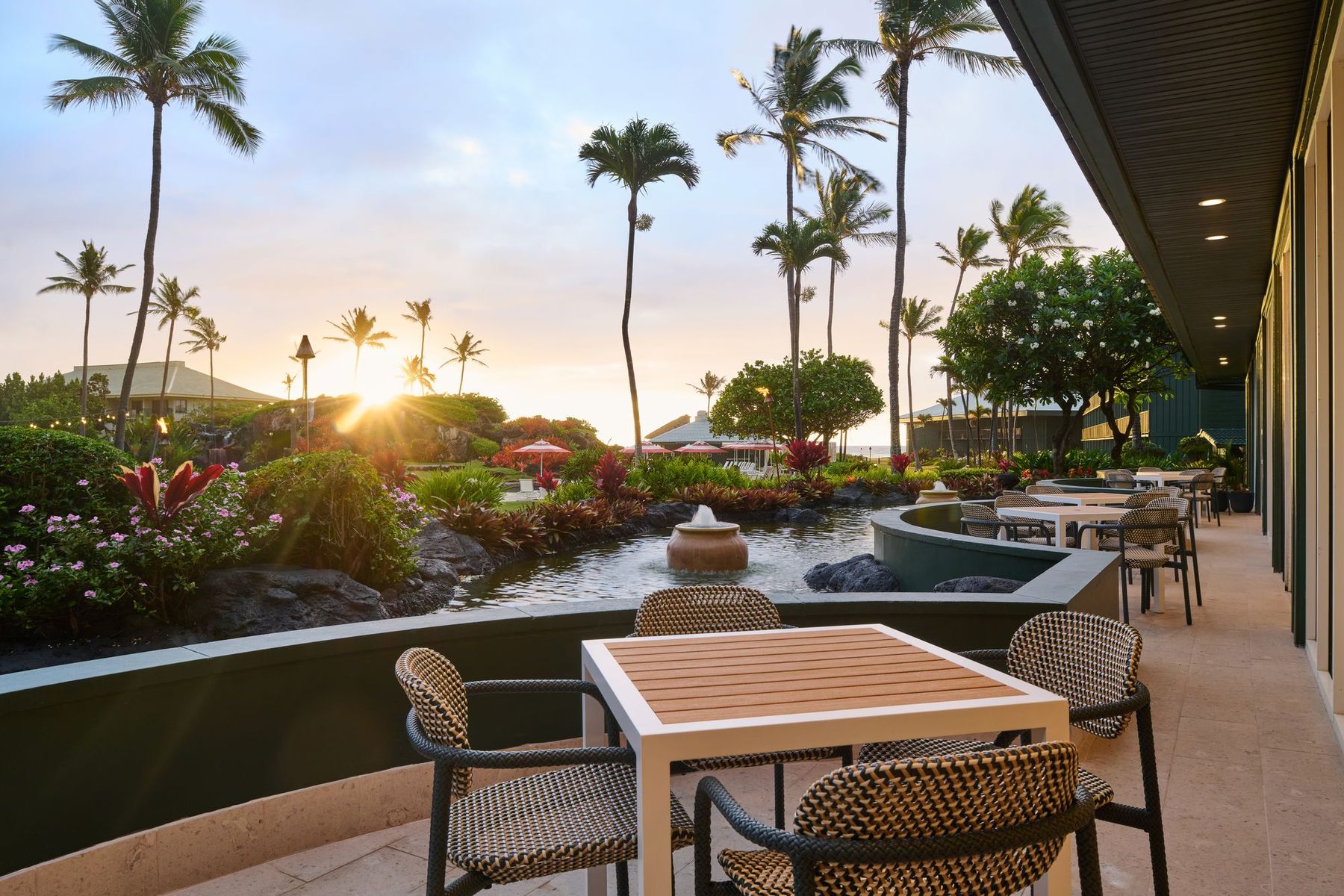 An oceanfront terrace at sunset at OUTRIGGER Kaua'i Beach Resort