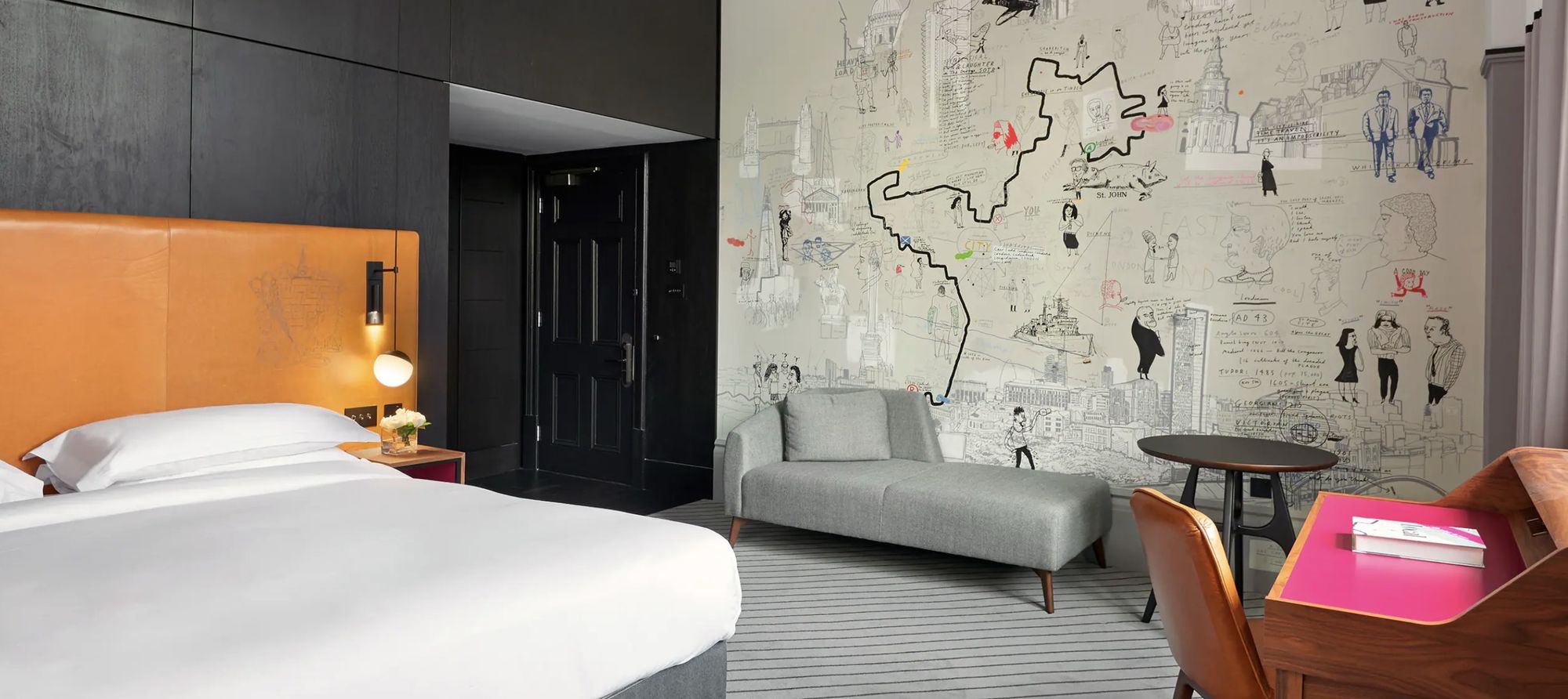 A guest room with a hand-drawn map mural