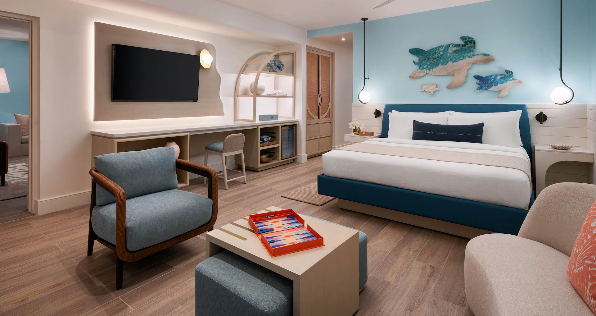 A bright guest room with a turtle mural at Beaches Turks & Caicos