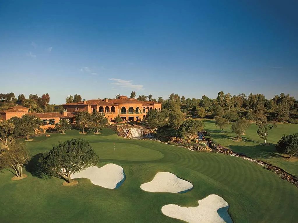 The resort above the green fairways and white bunkers of The Grand Golf Club