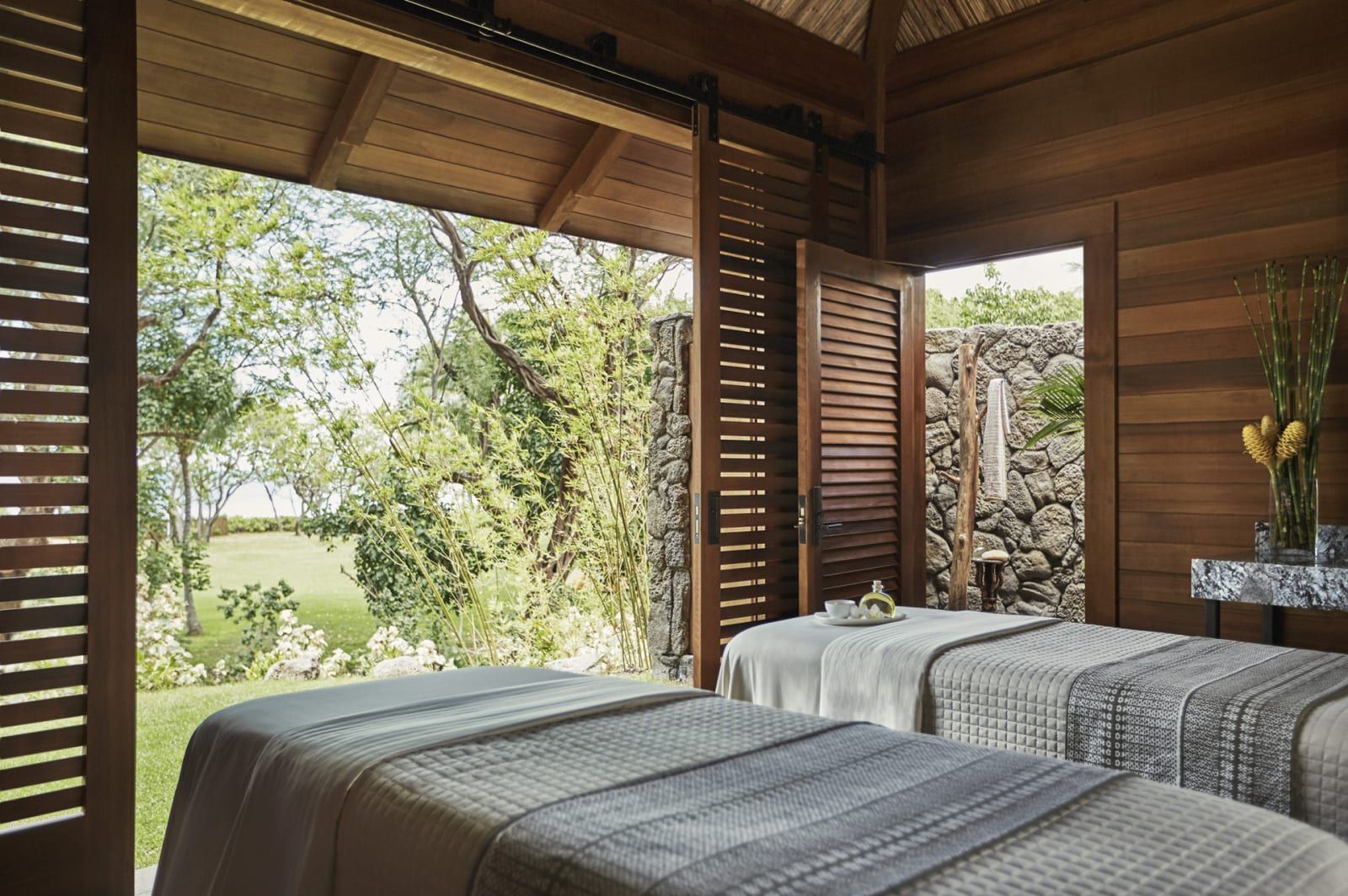 A spa treatment room opening onto a garden