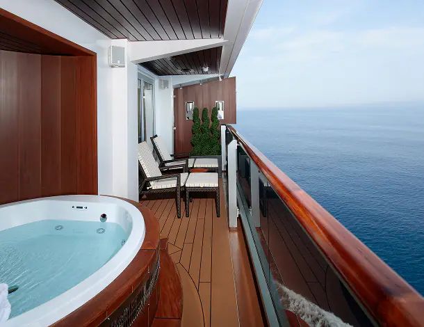 A suite veranda with a private hot tub facing the open sea