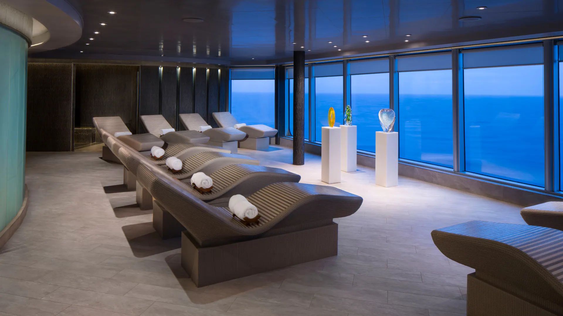Heated loungers facing the sea in the spa's thermal suite