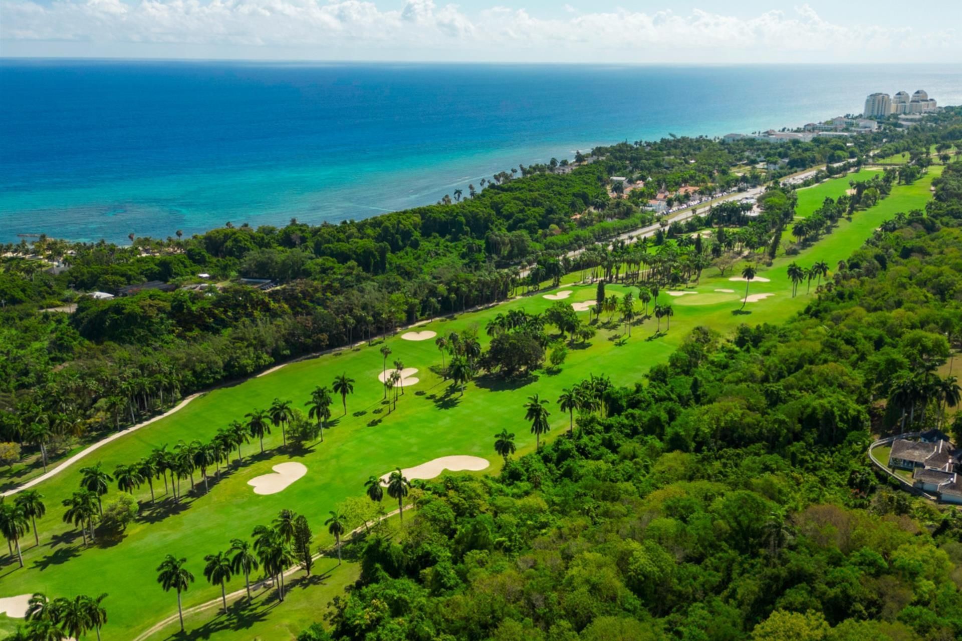 Aerial view of the golf course running toward the sea