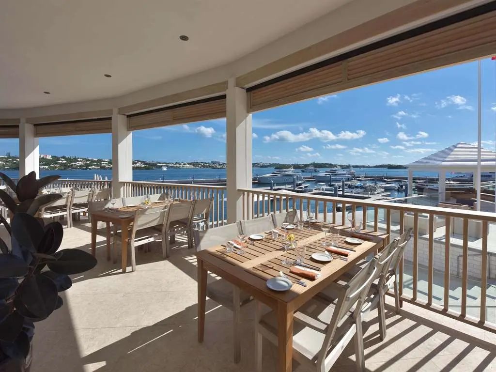 A shaded dining terrace overlooking the marina