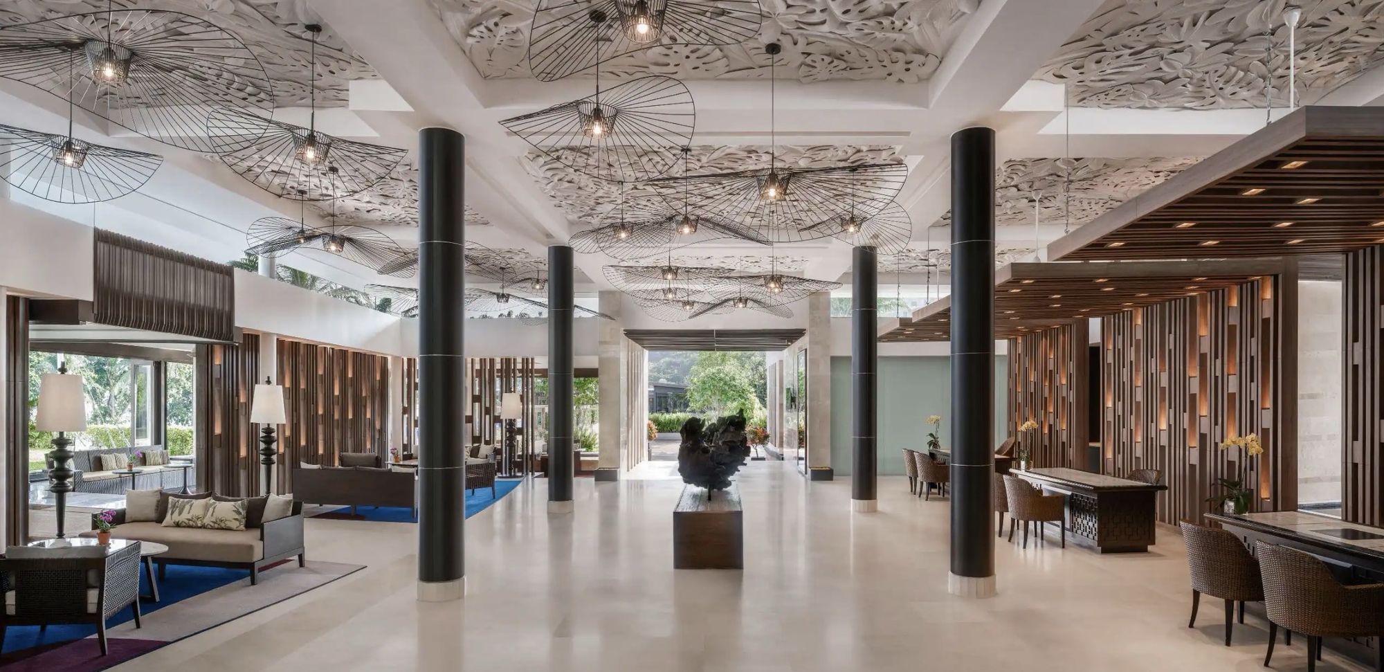 The airy white lobby with patterned ceilings