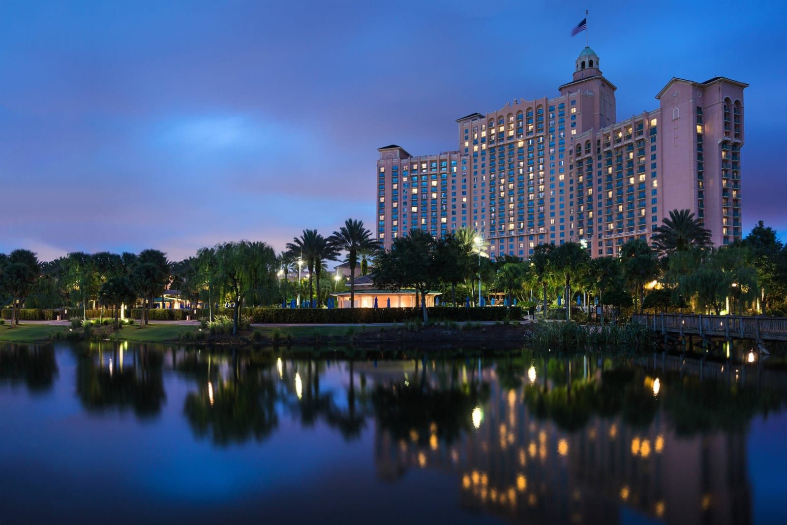 The resort tower reflected in the lake at twilight