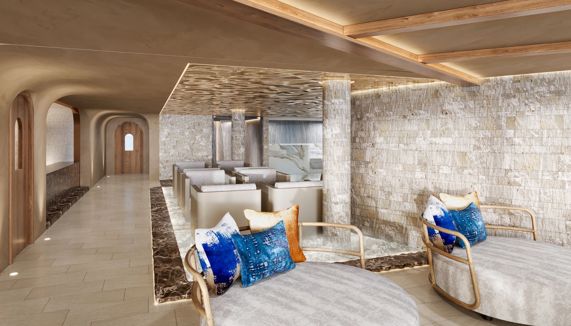 A calm spa lounge in stone and soft blues aboard Norwegian Aura