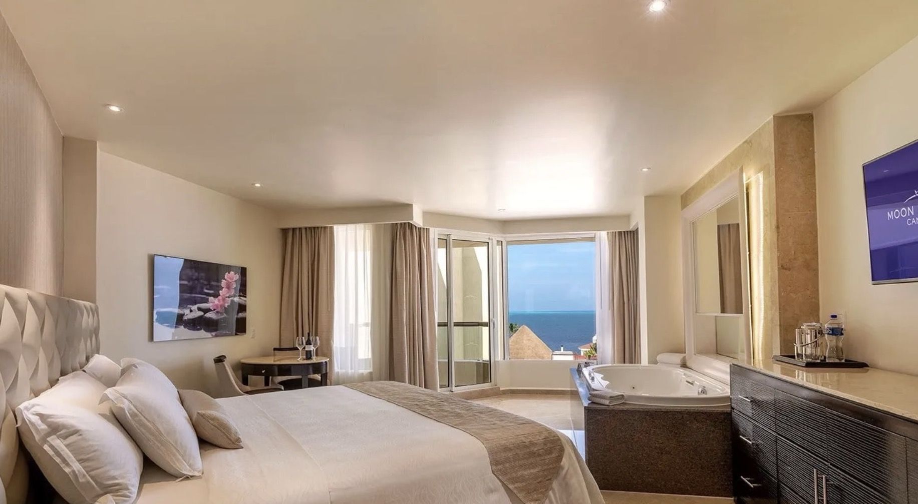 An ocean-view room at Moon Palace Cancún, with a whirlpool tub by the window