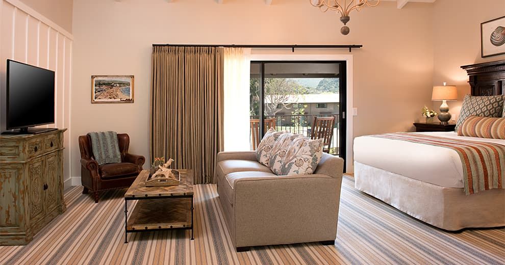 A guest room with a sofa and canyon views