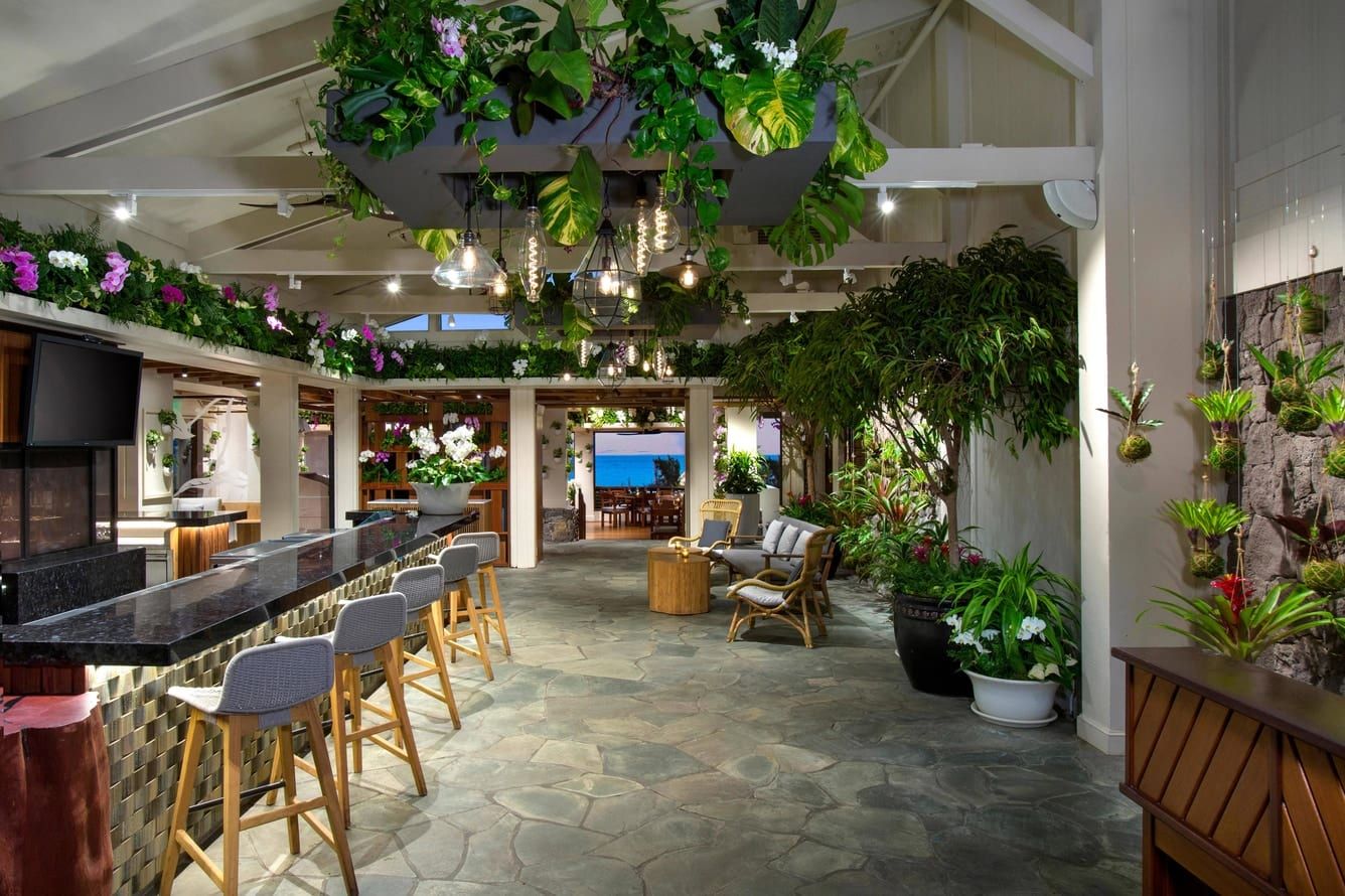 A plant-filled bar with stone floors