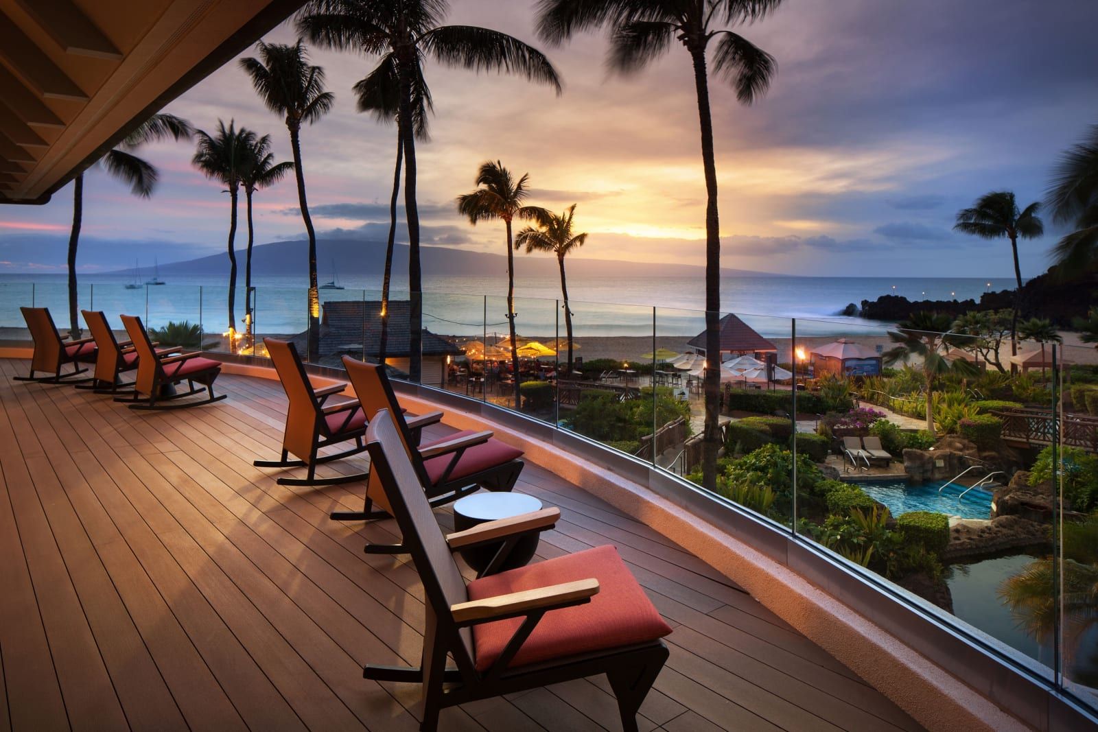 The open-air lobby terrace looking out to the ocean at sunset