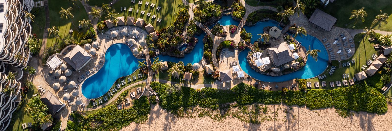 Aerial view of the lagoon-style pools beside the beach
