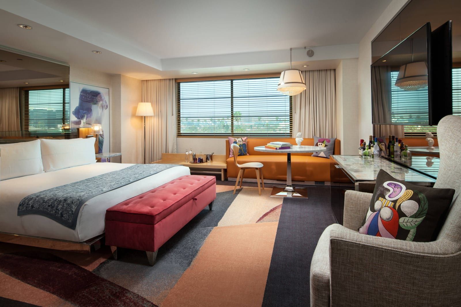 A king room with a red bench and city views