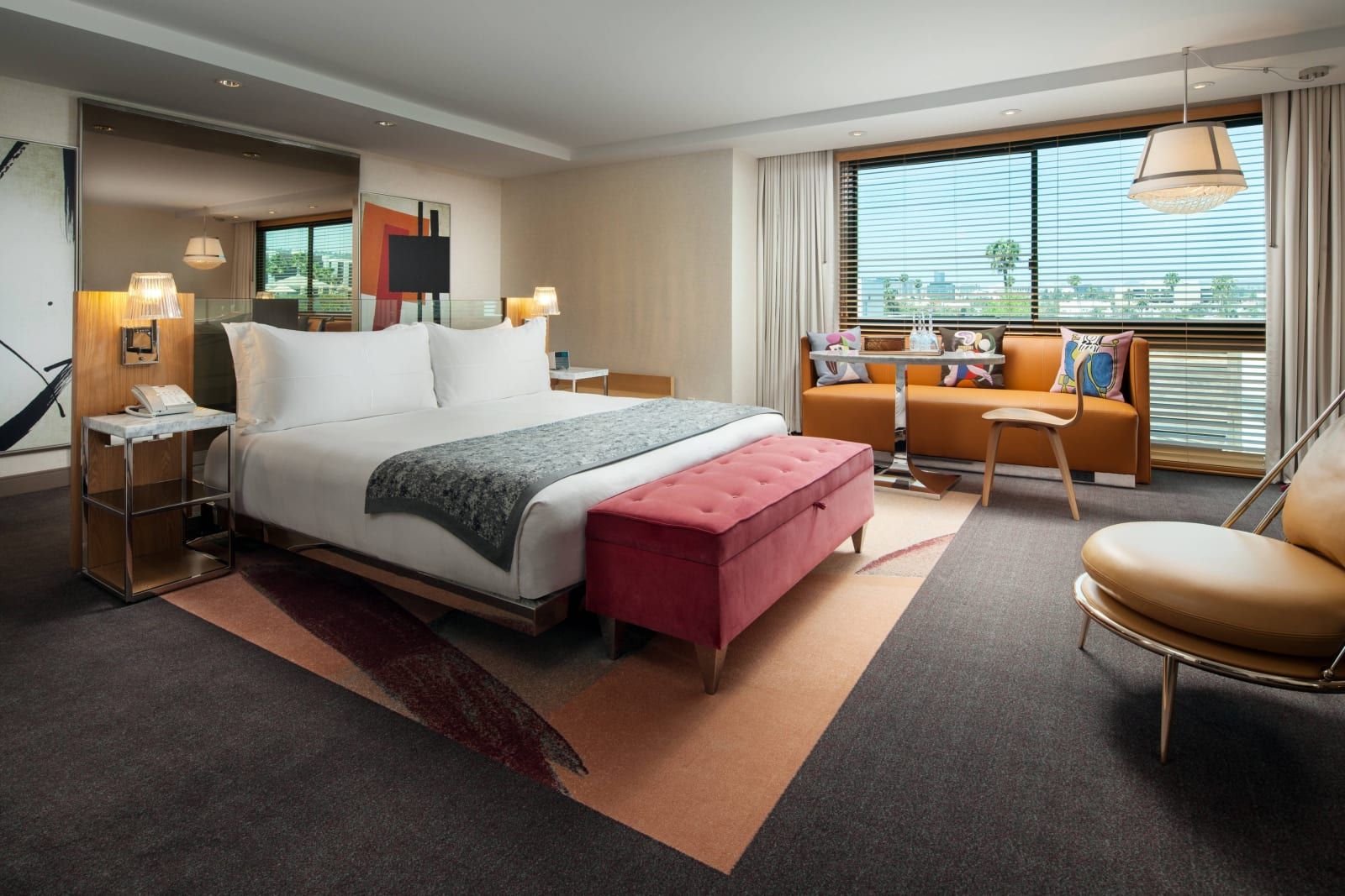 The Presidential Suite bedroom, with a lounge by the window