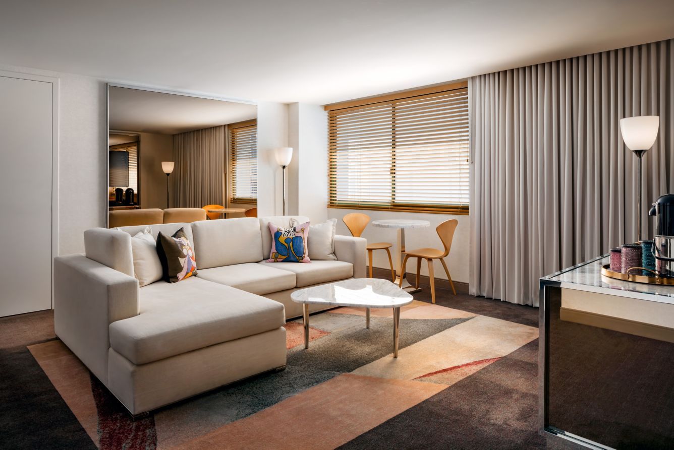 A suite sitting area in soft neutrals